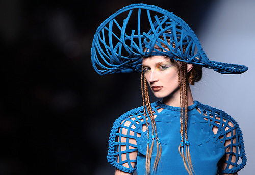 John Paul Gaultier Paris Haute Couture Spring Summer Ethnic: feathered  headwear and pleated strapless outfit Stock Photo - Alamy